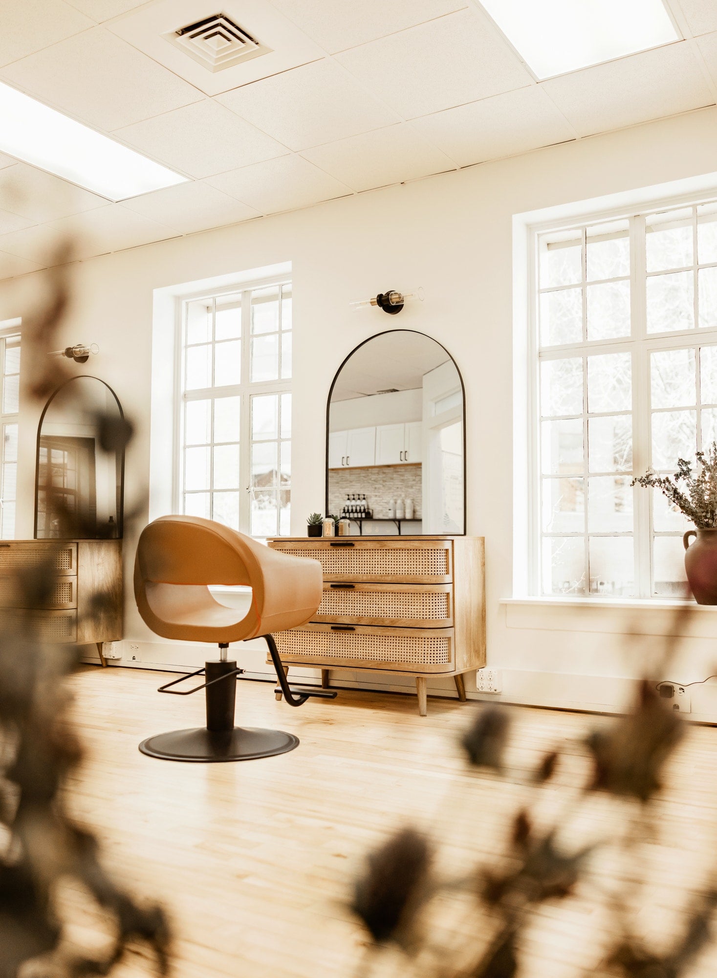Solvi Salon loft interior wide angle with chair and windows